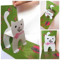 the cat is made out of paper and has pink ribbon