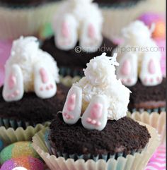 cupcakes with white frosting and bunny ears on them