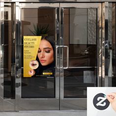 an advertisement on the side of a building with a woman's face in it