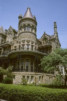 an old victorian style house with turrets on the top floor and balconies