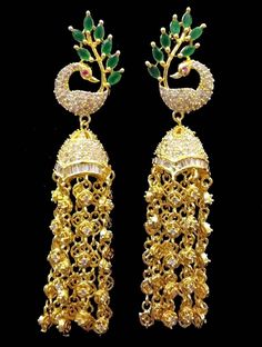 Very beautiful attractive ad earings to match with your ethnic wear with ad stones overall on the hangings too Peacock design Length 3.25 inches