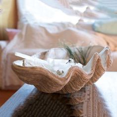 a wooden bowl sitting on top of a table