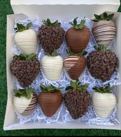 chocolate covered strawberries are arranged in a box on the grass, ready to be eaten