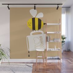 a wall mural with a bee holding a coffee mug