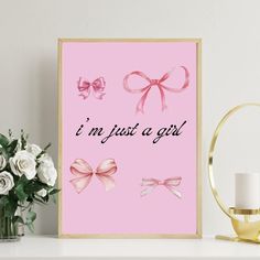 a pink poster with bows and the words i'm just a girl on it