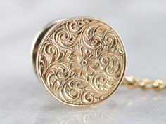 This handsome gold tie tack from the early 1900s features a hand engraved floral motif on the front that is quite lovely. Crafted of 14 karat yellow gold, this is a great piece for either sex, perfectly polished and ready to wear or gift! Metal: 14K Yellow Gold Measures: 12 x 17 mm Marks: "14K" Stamped on the reverse Gold Tie, Tie Tack, Early 1900s, Hand Engraving, Eternity Bands, Floral Motif, Floral Tie, Cufflinks, Ready To Wear