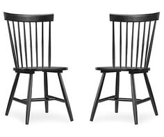 two black wooden chairs side by side on a white background, one is facing the other