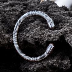 Unleash your inner warrior with our stunning Handmade Torque Viking Torc Cuff Bangle! This eye-catching piece of Norse jewelry is designed for the modern man who appreciates craftsmanship and heritage. Inspired by ancient Viking culture, this Viking bracelet features a robust torque design, symbolizing strength and bravery. Handcrafted with care, each cuff bangle showcases intricate details that reflect the rich history of Norse warriors. Whether you're dressing up for an event or adding a rugge Viking Torque, Bracelet Viking, Norse Jewelry, Inner Warrior, Viking Culture, Ancient Vikings, Viking Bracelet, Jewelry For Men, Bracelet Handmade