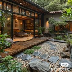 an outdoor living area with rocks and plants