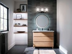 a bathroom with a sink, mirror and shelves