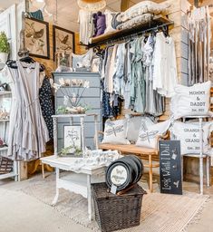 a room filled with lots of clothes and furniture