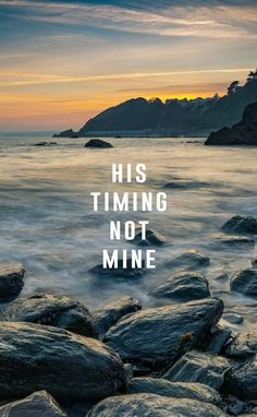 the words his time not mine are displayed on rocks in front of water and mountains