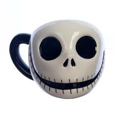 a coffee mug with the face of jack skellingy on it's side