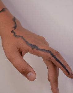 a person's hand with black ink on it