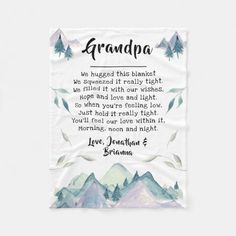 a tea towel with an image of mountains and the words grandpa written in black on it