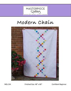 the modern chain quilt pattern is displayed in front of a brick wall and potted plant