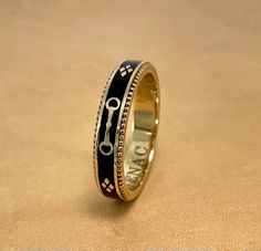 A slim stackable version of our Equus Enamel Ring. Beautiful combination of black enamel and 18 karat yellow gold. 4mm wide Equus (Latin for horse) Cheval (French for horse), stars and a snaffle bit in a continual pattern. Fine beaded detail on both edges. Absolutely gorgeous stacked with the Slim Lace Rein & Diamond Stack rings! Create your own combination! Hand made in the US Made to order, please allow 4-6 weeks for delivery. Luxury Black Enamel Ring, Formal Yellow Gold Enamel Ring With Black Details, Formal Yellow Gold Ring With Black Enamel, Formal Yellow Gold Black Enamel Ring, Designer Black Enamel Rings For Gift, Luxury 14k Gold Black Enamel Ring, Elegant Black Enamel Ring In 14k Gold, Elegant Black Enamel 14k Gold Ring, Elegant 14k Gold Black Enamel Ring