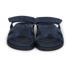 This pair of Hermes Chypre Techno sandals are in Bleu Celeste suede leather with Black rubber soles, adjustable straps, and Palladium hardware in a size 37.5 EU.Origin: ItalyCondition: New and never wornAccompanied by: Hermes box, dustbags and ribbonSize: 37.5 EU Suede Sandals With Tang Buckle And Round Toe, Designer Summer Slides With Tang Buckle, Designer Slides With Tang Buckle For Summer, Modern Suede Sandals With Buckle Closure, Designer Suede Sandals With Buckle Closure, Modern Suede Sandals For Summer, Blue Leather Slides For Summer, Luxury Beach Sandals With Tang Buckle, Luxury Blue Slides For Summer