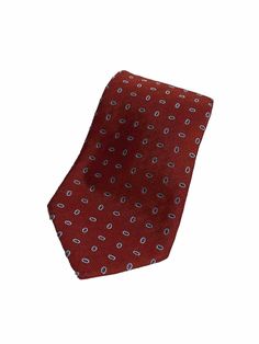 Add a touch of sophistication to your outfit with this stunning silk tie from Andrew Ties Zadi Milano. The intricate paisley pattern in shades of red makes it a must-have accessory for any stylish man. Crafted from high-quality silk, this tie exudes luxury and elegance, perfect for any formal occasion. The brand's attention to detail is evident in every stitch, making it a true statement piece. Elevate your style and make a lasting impression with this Italian-made masterpiece. Formal Red Silk Tie, Elegant Red Neckwear With Ties, Red Silk Tie For Business, Red Standard Tie For Semi-formal Occasions, Business Red Neckwear With Inside Ties, Elegant Red Silk Tie, Classic Red Neckwear With Ties, Red Silk Ties For Business, Red Necktie For Semi-formal Occasions