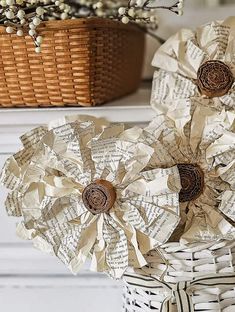 some paper flowers are sitting in a basket