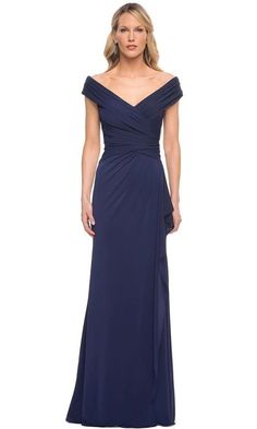 As you shine in this La Femme 30040 creation, you will leave them speechless. This dress has an off-the-shoulder neckline and is exceptionally draped with pleats in jersey fabric. The back features ruched details, a wide shoulder frame, and a center zipper. An overlaying fabric cascades from the waistband, creating a layer over the A-line silhouette and ending with a sweep train. This La Femme creation will highlight your natural beauty and grace. The model is dressed in navy. Full Length Skirts, Column Gown, A Line Gown, Bride Style, Dress Purchase, Long Gown, Dresses Short, Long Dresses, Mother Of The Bride Dresses