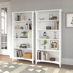 a white bookcase filled with lots of books