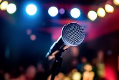 a microphone in front of an audience at a concert