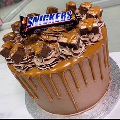 there is a cake with chocolate and peanut butter on top that says sucker's