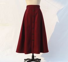 " *Pleated skirt *Length approx: 90cm *There is a zipper on the side *Wash by hand or machine with cold water *The Skirt is made of wool. If you want other colors on the color card, please leave the color card number when you place your order. Auailable in women's us size XXS to 3XL as well as custom size and plus size  XXS: Waist:66cm/26\" Length:90cm/35.5\" XS: Waist:70cm/27.5\" Length:90cm/35.5\" S: Waist:74cm/29\" Length:90cm/35.5\" M: Waist:78cm/30.5\" Length:90cm/35.5\" L: Waist:82cm/32\" Red Winter Skirt, Red Maxi Skirt For Fall, Burgundy Flared Skirt For Fall, Button Skirt Outfit, 40s Skirt, Warm Skirt, Long Wool Skirt, Warm Skirts, Long Linen Skirt