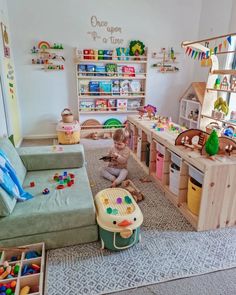 a child playing with toys in a playroom