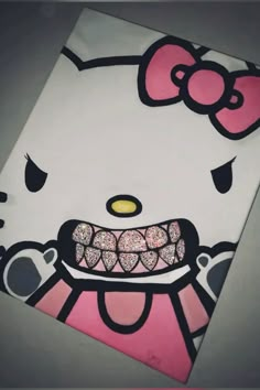 an image of a hello kitty paper bag with glitters on it's face