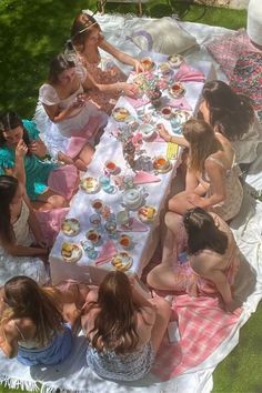 a group of women sitting at a picnic table