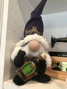 a stuffed toy is sitting on top of a shelf