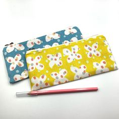 This is a fully soft zipper pen case. This pen case is made from cotton fabric imported from Japan.  It is fully lined. The price is for a pen case.  Please select one you like.  Outer fabric: Japanese fabric. Cotton 100%. Lining: White base with gold dots printed fabric.  Cotton 100%. Zip: YKK zip ★The print placement may differ from the photos. ★Please note, the colour may display differently on different monitors.  Approx. Width- 21 cm (8.26 inch) Height - 9.5 cm (3.74 inch) Zip opening - 18 Cotton Pencil Case With Pen Holders For Personal Use, Cotton Pencil Case With Pen Holders As Gift, Everyday Cotton Pencil Case With Zipper, Cotton Pencil Case With Zipper Pouch, Rectangular Cotton Pencil Case With Zipper, Cotton Pencil Case With Zipper, Rectangular Cotton Pencil Case As A Gift, Rectangular Cotton Pencil Case As Gift, Yellow Zipper Pouch Pencil Case