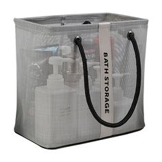 a clear shopping bag with black handles and white trimmings on the front, featuring an advertise for bath storage