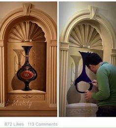 a man is looking at a vase on display