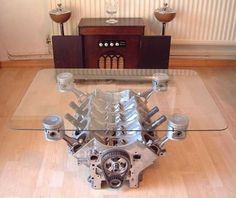 an engine is sitting on the floor in front of a table