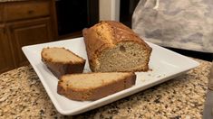 a loaf of banana bread on a white plate