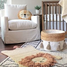 a baby's room with a crib, chair and rugs on the floor