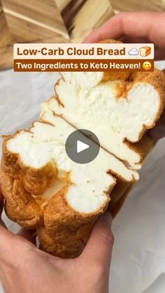 someone is holding a loaf of bread with white icing on it and the video below shows how to make low - carb cloud bread for two ingredients to keto heaven