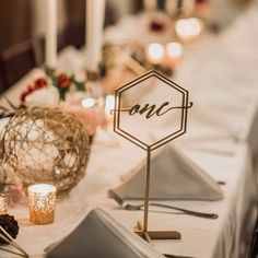 the table is set with candles and place settings