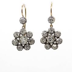 The Natalie earrings are inspired by the Victorian style. They center 2 old mine cut diamonds of K color and SI1 clarity that weigh 1.10ctw. The center stones are surrounded by 16 old mine cut diamonds of J/K color and VS2-SI1 clarity that weigh 2.70ctw. Earring measurement: 22mm by 14mm by 4mm Total weight: 5.0 grams / 3.2 dwt Antique Diamond Earrings, Antique Diamond, Women Diamond, Contemporary Jewelry, Victorian Style, Victorian Fashion, Gold And Silver, Diamond Earrings, Diamond Cuts