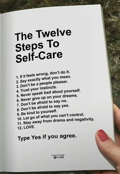 a person holding up a book with the title'the twelve steps to self - care '