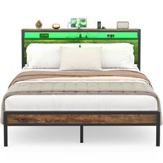 the bed is made up with white pillows and green lights on top of it's headboard