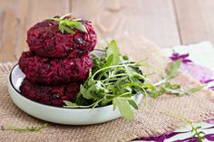 stack of beet cakes on plate with glassware