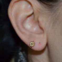 "This is a very beautiful and delicate 14k Gold Filled flower tragus ring. This can be a perfect gift for you or your loved one! The listing is for ONE hoop (not for a pair). The wire ends were rounded and polished to provide you with a smooth end for insertion. The earring was then polished. To open the ring gently twist the ends sideways, slip into the hole and then gently twist the ends back for a continuous hoop. You can find answers to most of your questions (like \"earrings size & gaug Pierced Yellow Gold Flower Earrings, Pierced Round Yellow Gold Flower Earrings, Yellow Gold Pierced Flower Earrings, Yellow Gold Round Pierced Flower Earrings, Yellow Gold Round Flower Earrings, Dainty Yellow Gold Pierced Flower Earrings, Dainty Hypoallergenic Round Flower Earrings, Delicate Hypoallergenic Round Flower Earrings, Dainty White Gold Flower Earrings