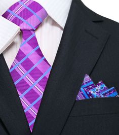 Purple and Blue Plaid Silk Necktie This purple with light blue plaid necktie is a sophisticated and stylish accessory that will add a touch of elegance and refinement to any outfit. The plaid pattern features a range of shades of purple and light blue, creating a sense of depth and complexity that is visually striking and sophisticated. When it comes to pairing this necktie with dress shirts, there are several options that work well. A solid white dress shirt is always a classic choice, as it pr Formal Purple Standard Tie, Formal Purple Neckwear With Ties, Purple Standard Tie For Black Tie Events, Purple Suit And Tie Accessories For Black Tie Events, White Dress Shirts, Depth And Complexity, Charcoal Gray Suit, Light Blue Dress Shirt, Semi Formal Attire