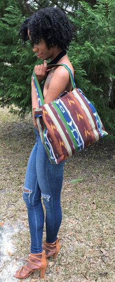 This tote bag is made with handwoven Ikat fabric. The colors are blue, green,and cream. The bag is lined with 2 inside pockets. Drawstring closure Dimensions: 14"L x 13 1/2"H x 5"W Weight:  1 lb 7.4oz Straps:  24"L Looks great for any occasion.. Bohemian Reversible Hobo Tote Bag, Green Canvas Rectangular Hobo Bag, Green Rectangular Canvas Hobo Bag, Rectangular Green Canvas Hobo Bag, Green Bohemian Tote Bucket Bag, Green Bohemian Bucket Bag Tote, Green Bohemian Bucket Tote Bag, Everyday Reversible Multicolor Hobo Bag, Multicolor Rectangular Canvas Hobo Bag