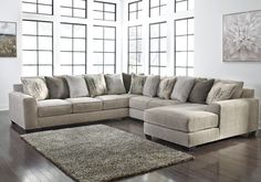 a living room with a sectional couch and rug