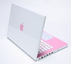 an apple laptop computer is shown on a white surface with pink accents and silver hardware